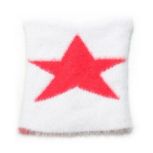 Close-up of the fluffy faux fur texture with a red star on the white knitted beanie