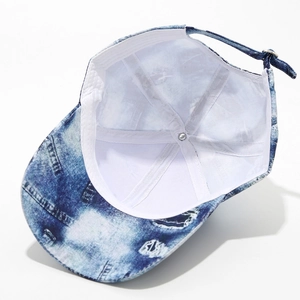 Internal structure of tie-dye baseball cap with metal buckle and sweatband detail