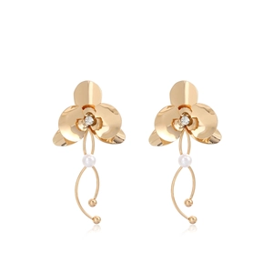 Detail of flower dangle earrings with gold petals, clear rhinestone, and white pearls