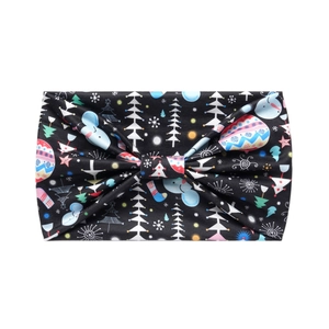 Close-up of black elastic headband with colorful Christmas tree and snowman patterns