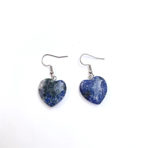 Detailed close-up of heart-shaped natural stone earrings with blue mineral texture