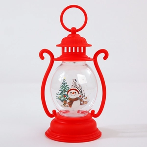 Detail of red Christmas lantern with snowman and tree micro landscape inside