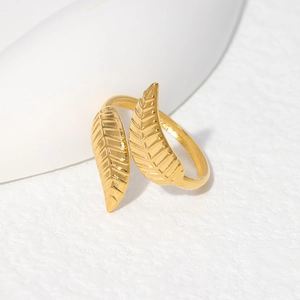 Macro shot of gold leaf ring detail showing realistic vein texture and matte finish