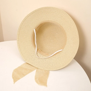 Detailed macro view of the inner sweatband and straw weave texture on the sun hat
