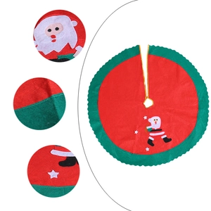 Christmas tree skirt with Santa Claus applique and star pattern in red and green felt