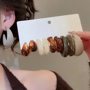 Acrylic C-shaped earring set featuring amber and resin hoop drop designs for women
