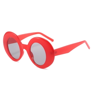 Retro oversized round sunglasses in vibrant red frame with gradient dark grey lenses