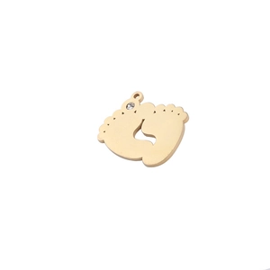 Polished gold baby feet pendant with sparkling rhinestone detail on white background