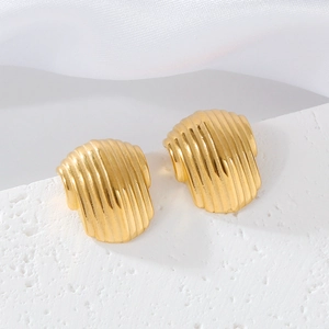 Elegant gold ribbed stainless steel hoop earrings with a textured vertical wave design