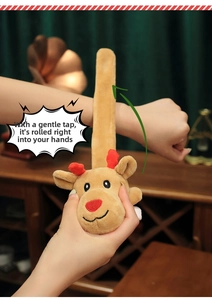 Detail showing the snap action of the plush reindeer slap bracelet on a wrist