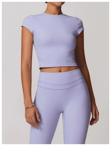 Macro detail of lavender yoga set showing high-waist stitching and soft matte fabric
