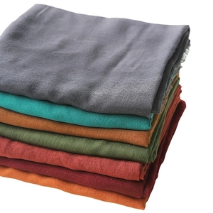 Solid color linen cotton scarf collection showing multiple earthy tones and fringe details