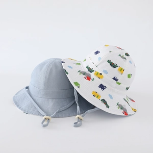 Detail view of cotton sun hat with cartoon patterns and adjustable chin strap