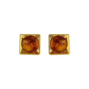Irregular geometric resin earrings with amber stones and gold metal borders on white backdrop