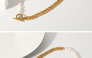 Detailed close-up of OT clasp connecting gold Cuban chain and white freshwater pearls
