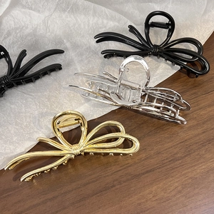 Elegant bow-shaped alloy hair claws in gold, silver, and black finish for women