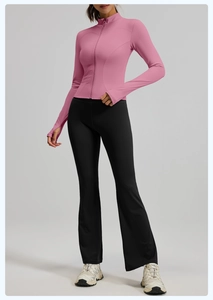 Pink slim-fit zip-up yoga jacket with thumb holes and black flared fitness leggings