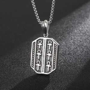 Detailed view of silver stainless steel hexagon pendant with engraved Ankh symbols on box chain