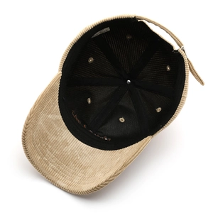 Internal view of khaki corduroy baseball cap showing lining and New York brim embroidery