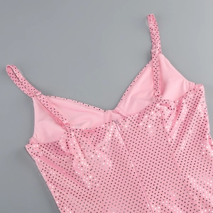 Detail of pink sequin fabric showing the adjustable straps and hidden zipper closure