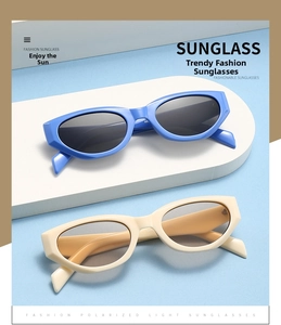 Detailed view of cat-eye sunglasses with polarized lenses on a modern geometric display
