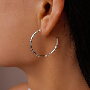 Elegant polished silver C-shaped hoop earrings for women with a sleek mirror finish