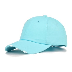 Close-up of a light blue washed baseball cap with distressed brim and vintage worn detail