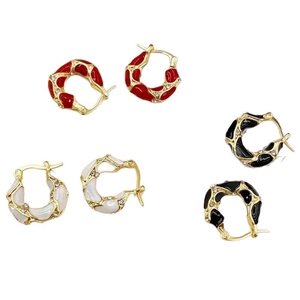 Three pairs of irregular lava drip enamel hoop earrings in red, white and black with crystals