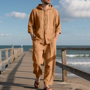 Detail of men's ginger linen hooded shirt and pants set with drawstring and buttons