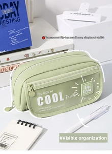 Close-up of light green pencil case with clear PVC window and inspiration text