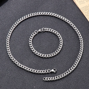 Detail of 7mm stainless steel cuban link chain set with necklace and bracelet