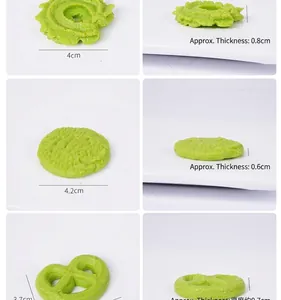 Detailed view of green miniature cookies with thickness and diameter measurements
