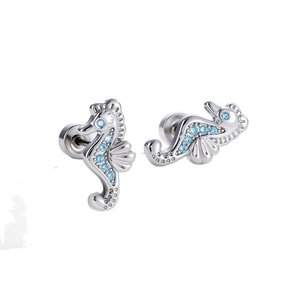 Silver seahorse cartilage stud earrings with blue cubic zirconia on white background