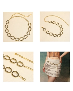 Macro details of vintage gold metal waist chain with adjustable lobster clasp and links