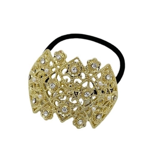 Golden hollow hair tie with rhinestones and pearl accents on a black elastic band