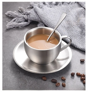 Detailed overhead shot of 304 stainless steel coffee cup set with saucer and spoon