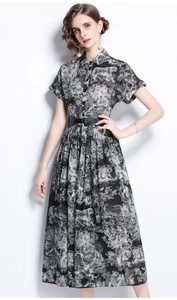 Detailed view of the vintage animal print shirt dress with a stylish black wide belt