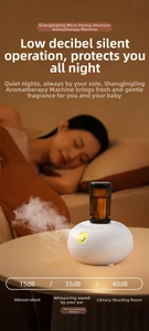 Close-up of waterless essential oil diffuser emitting fine mist at 15dB low noise level