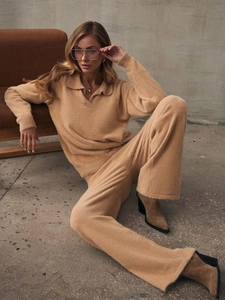 Detail view of camel knit two-piece set featuring a soft polo sweater and wide-leg pants