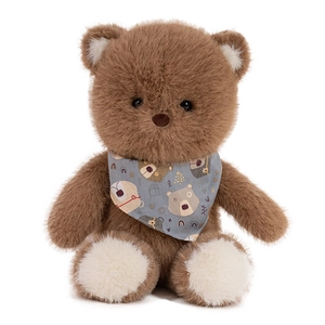 Plush brown teddy bear toy wearing a blue floral scarf on a white background