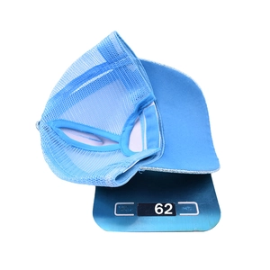 Blue glitter trucker hat for ponytail with breathable mesh weighing 62g on digital scale