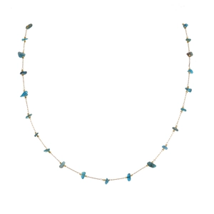 Detail view of gold chain necklace with natural blue crushed stone beads and Evil Eye charm
