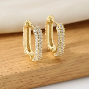 Elegant gold U-shaped hoop earrings with shimmering cubic zirconia pave setting