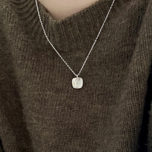 Minimalist 925 sterling silver necklace with square letter S pendant on model