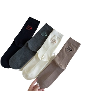 Set of four cotton mid-calf socks with heart embroidery and Follow Your Heart text