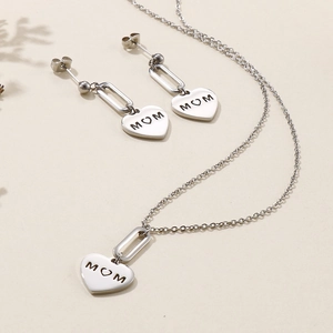 Golden titanium steel jewelry set featuring MOM heart pendant necklace and stud earrings