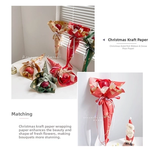 Close-up of Christmas kraft wrapping paper with bell and tree patterns and satin ribbons