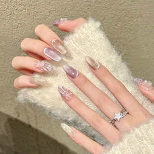 Purple gradient almond press-on nails with 3D pearls, stars, and shell textures