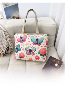 Detail of canvas tote bag with butterfly floral prints and durable hemp rope handles