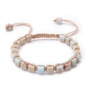 Close-up of bohemian woven bracelet with square blue imperial stones and tan wax cords